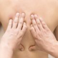 close up hands massaging client scaled e1749028549476